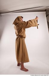 JOEL_ADAMSON WITH CRUCIFIX AND SWORD